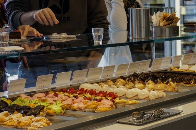 Cake selection behind counter at Pasticceria Ducale.