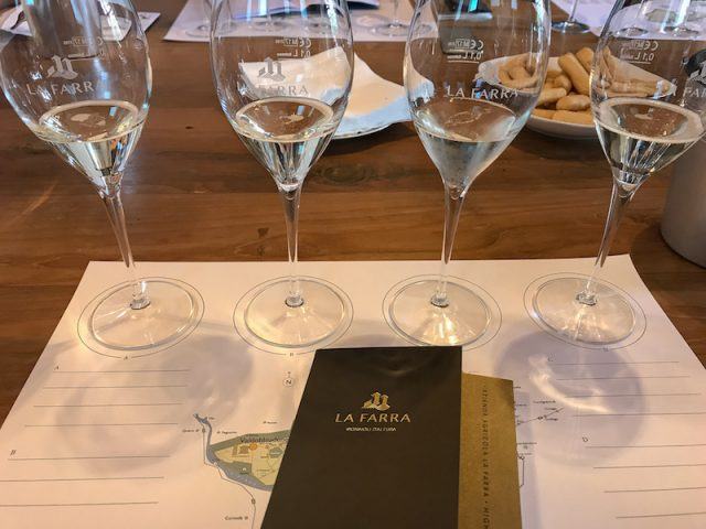 La Farra Wine Tasting sheet and four glasses