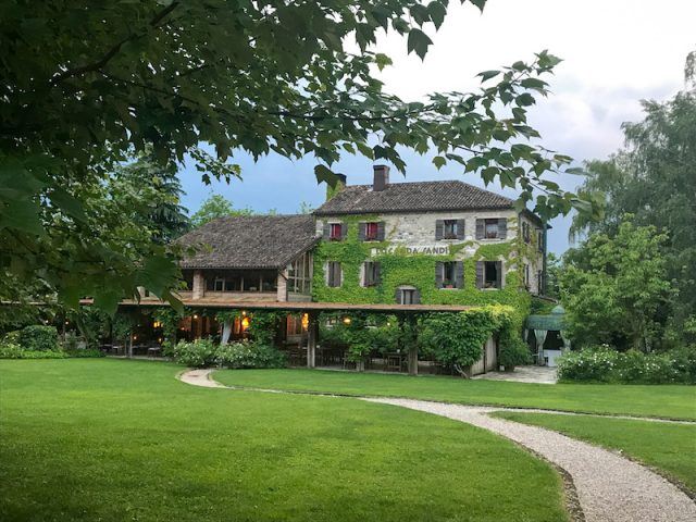 Path leading to ivy covered house of Locanda Sandi