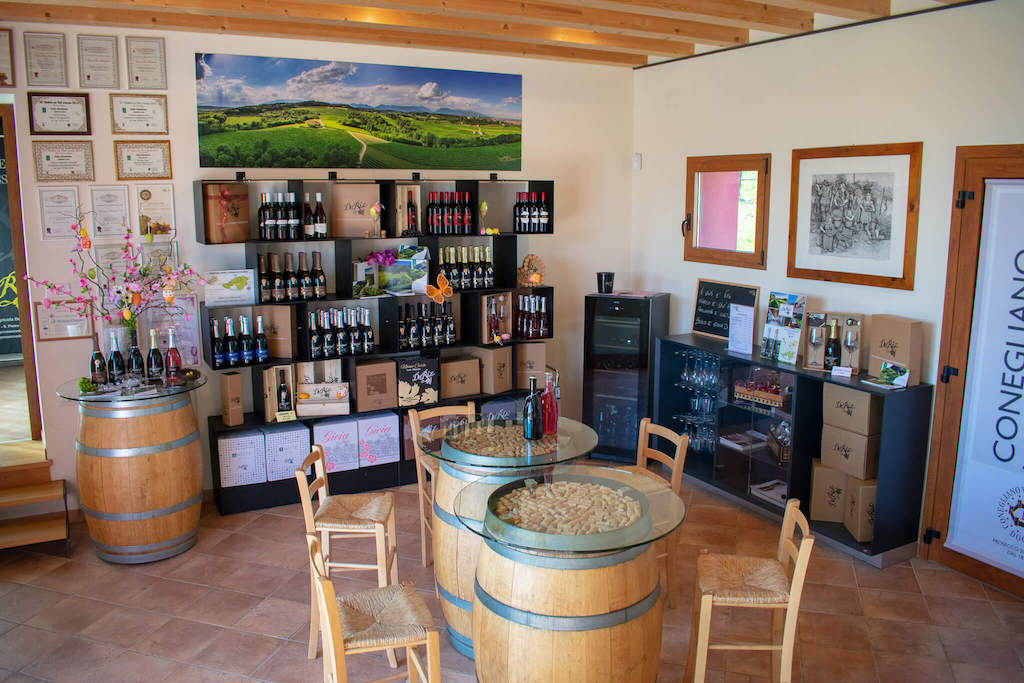 De Riz wine tasting room with barrels and chairs