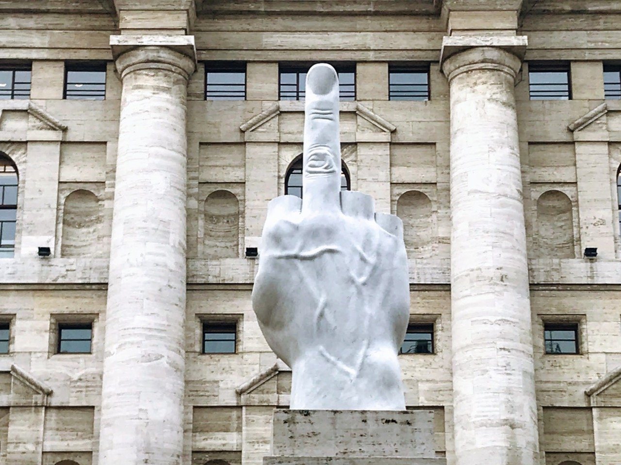 Milan LOVE statue close up of middle finger