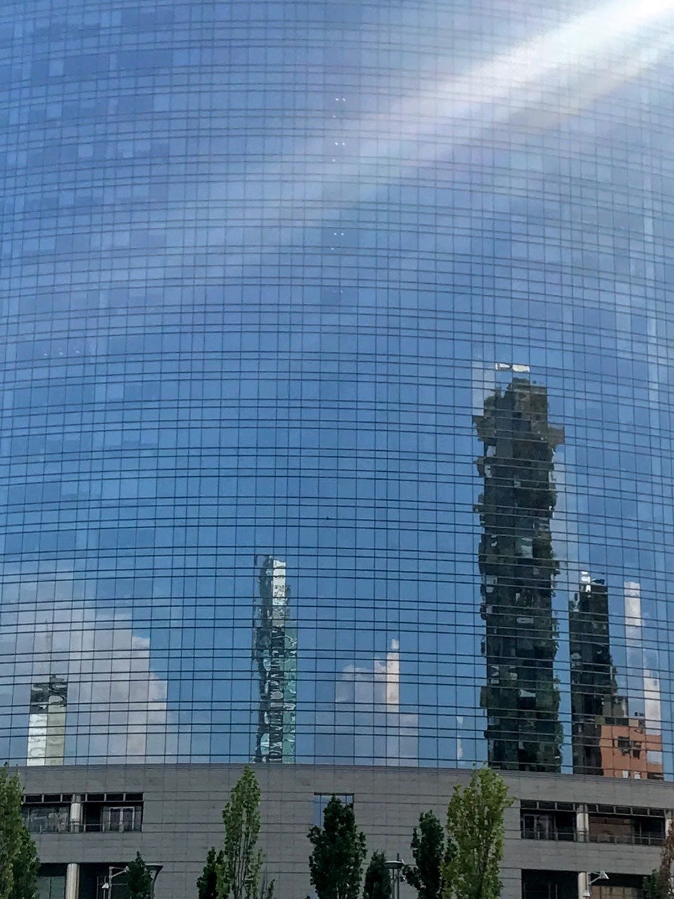 Close up of the glass front of Torre Unicredit in Milan