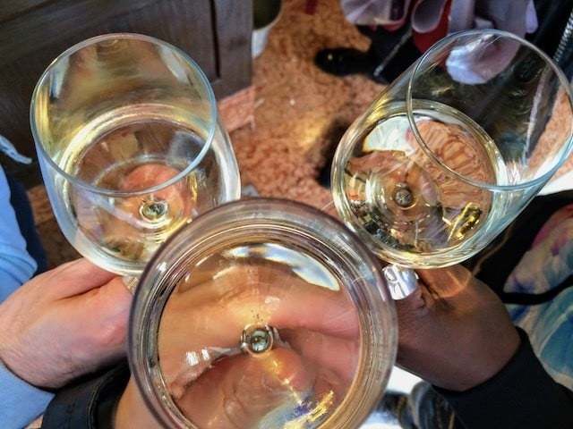 three wine glasses in cheers 