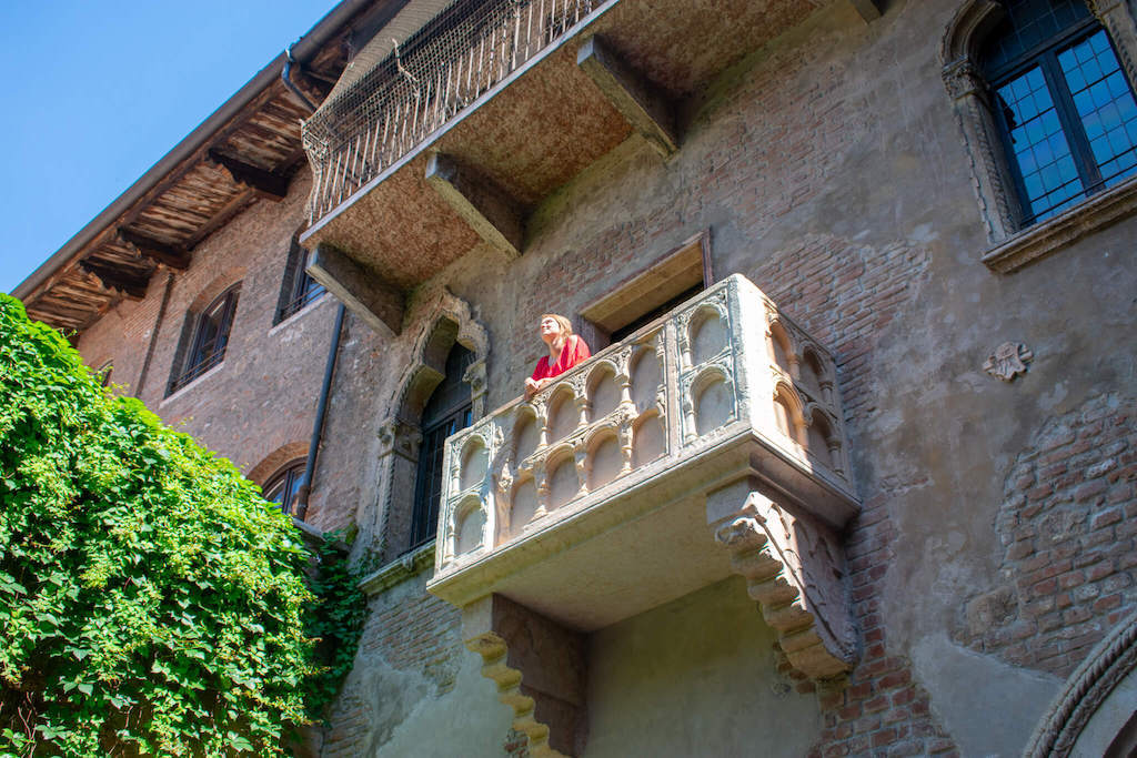 Juliet's Balcony with woman in Verona Italy