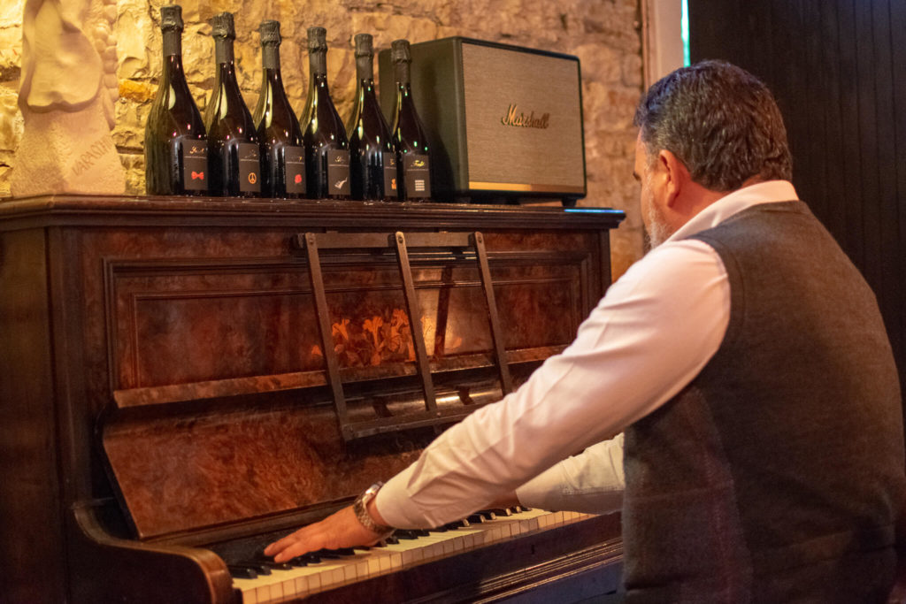 owner playing piano at Varaschin Prosecco winery