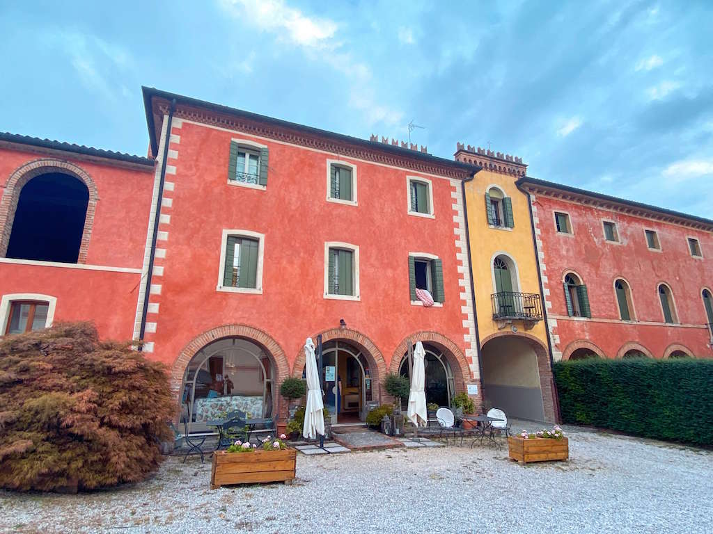 grand terracotta and yellow exterior of Villa Clementina.