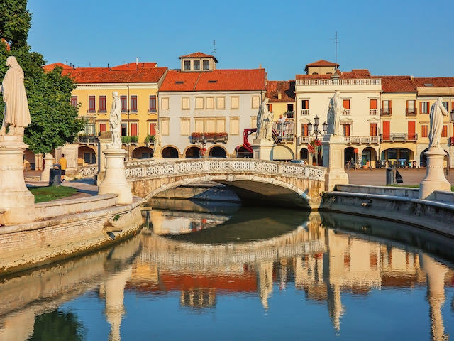 Canal in Padua Italy with bright houses