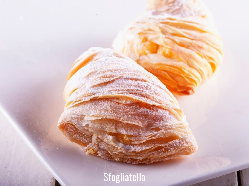 sfogliatella flaky pastry with icing sugar dusted on top