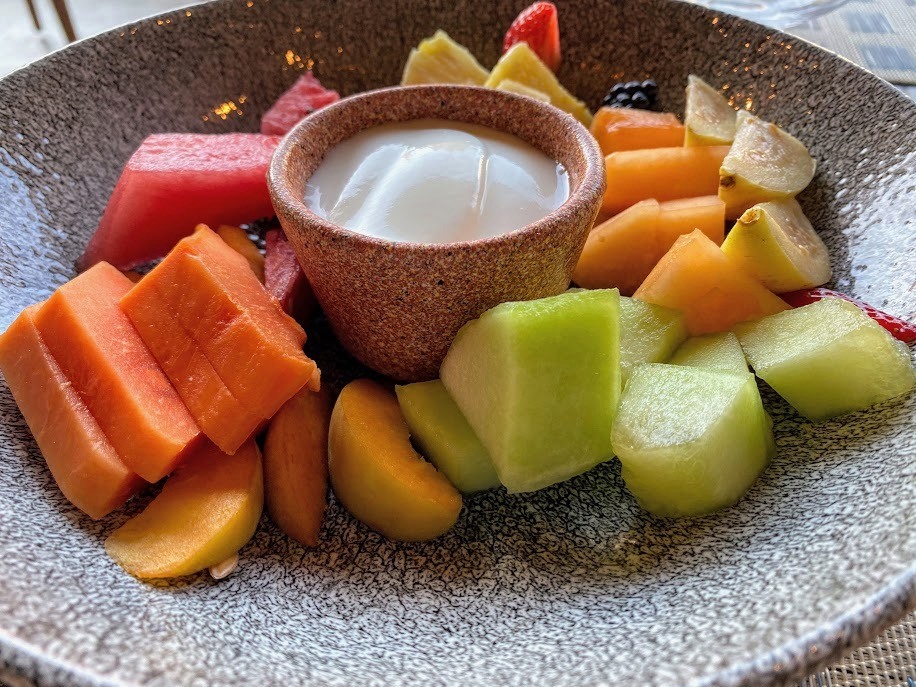 fruit and yoghurt in earthenware bowls