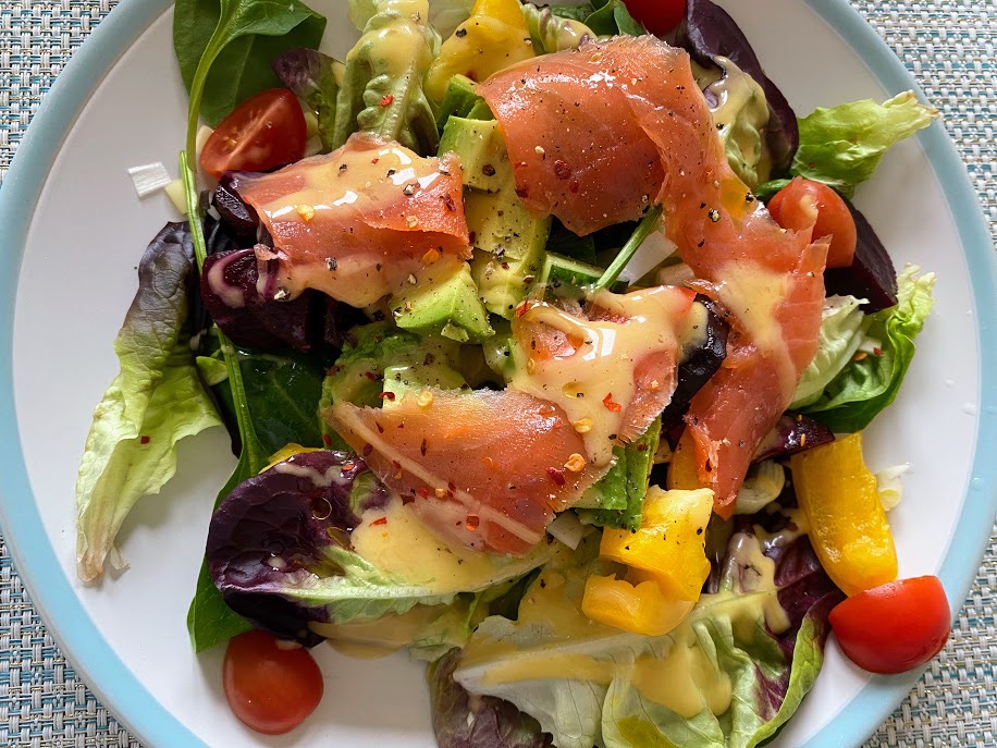 smoked salmon salad on a blue and white plate