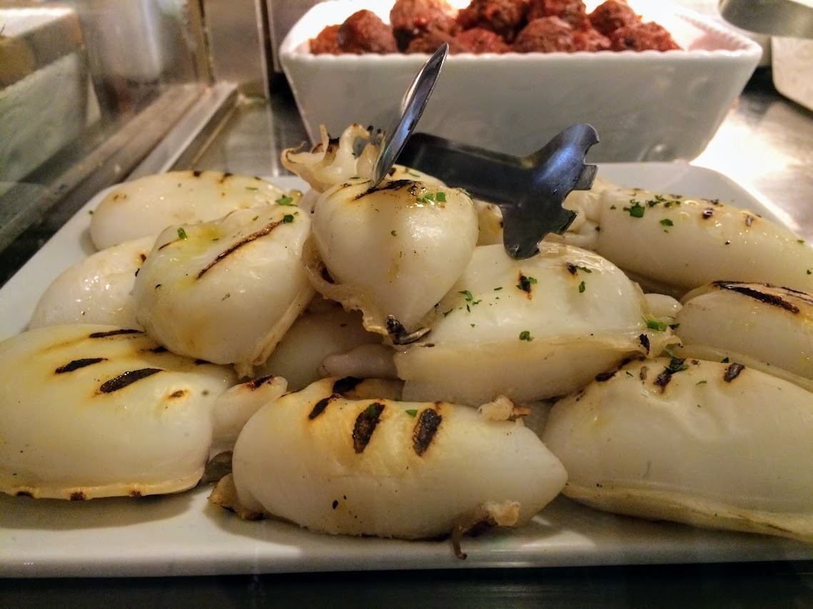 squid and meatball antipasti in old restaurant in Venice