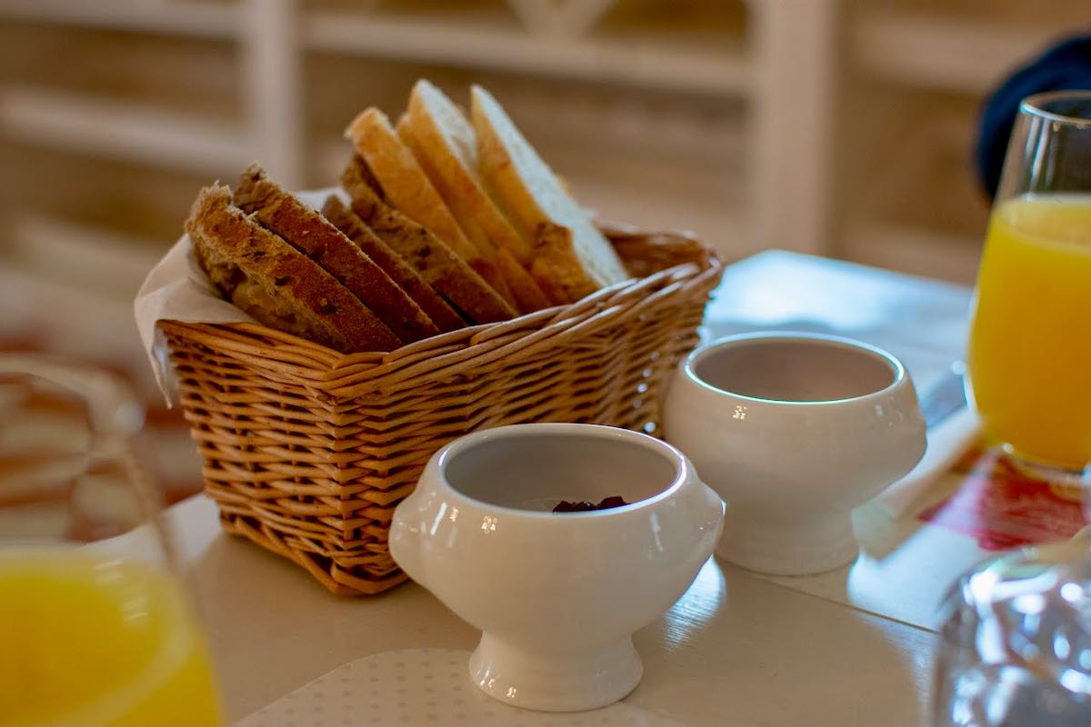 Basket of bread and jam dishes