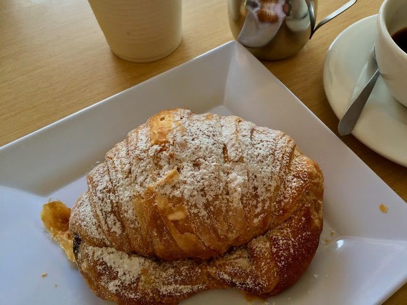 Croissant dusted with powdered sugar