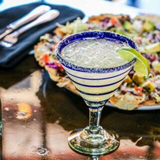 Glass of Prosecco margarita with nachos.