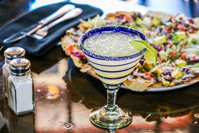 Glass of Prosecco margarita with nachos.